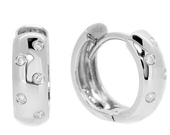 May include: Silver hoop earrings with a polished finish and small clear cubic zirconia stones set around the hoop.