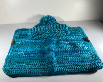 A crochet toddler vest with matching hat