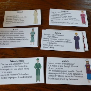 May include: A set of ten white cards with colorful illustrations and text about biblical figures. Each card features a different figure, including Zilpah, Jotham, Levi, Jabin, Nicodemus, and Zadok. The cards are arranged in two rows of five.