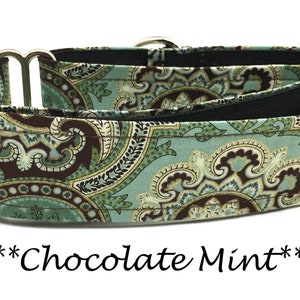 May include: A dog collar with a paisley pattern in shades of teal, brown, and cream. The collar has silver-colored metal hardware and a black interior lining. The text "Chocolate Mint" is displayed below the collar.