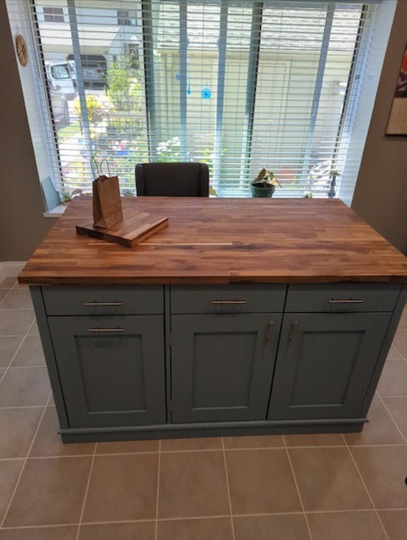 Custom kitchen island with overhang for seating. Kitchen cabinet storage. Handcrafted furniture. Made in USA. Made to order and custom built kitchen island. Heirloom quality furniture