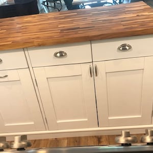 Custom kitchen island with overhang for seating. Kitchen cabinet storage. Handcrafted furniture. Made in USA. Made to order and custom built kitchen island. Heirloom quality furniture