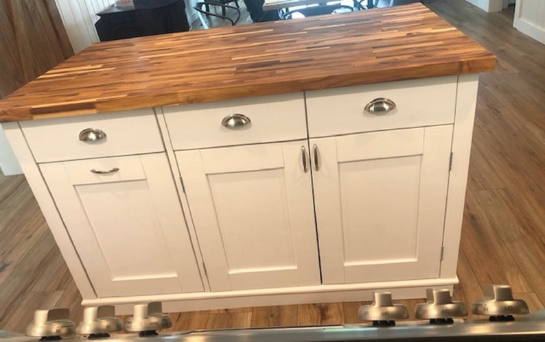 Custom kitchen island with overhang for seating. Kitchen cabinet storage. Handcrafted furniture. Made in USA. Made to order and custom built kitchen island. Heirloom quality furniture