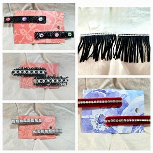 May include: Four sets of hair clips on white backgrounds. The first set is black with colorful rhinestones. The second set is black and white checkered fabric. The third set is silver with clear rhinestones. The fourth set is black fringe.