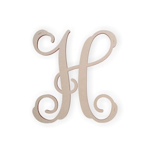 May include: A wooden letter "H" in a cursive font. The letter is a light tan color with a darker brown edge, set against a white background. The design features elegant swirls and curves, suitable for home decor or personalized gifts.