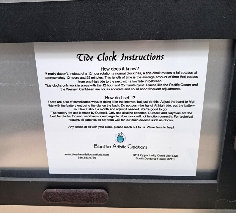May include: A white instructional card for a tide clock with black text titled Tide Clock Instructions. It explains how the clock functions on a 12 hour and 25 minute cycle, how to set the hand, and battery recommendations by BlueFire Artistic Creations.