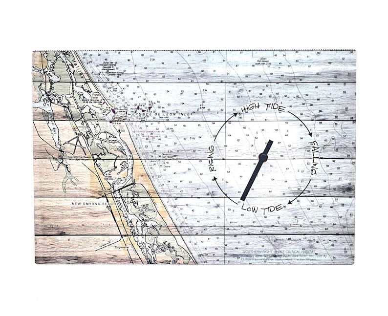 May include: A rectangular wooden tide clock featuring a nautical chart of the New Smyrna Beach area. The face displays depth soundings, land contours, and a circular indicator with the text High Tide, Falling, Low Tide, and Rising around a black hand.