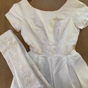 Beautiful vintage wedding dress minimalist with embroidered train