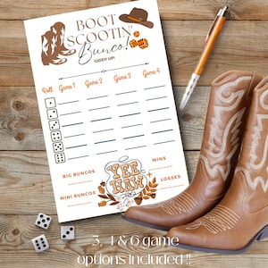May include: A white paper Bunco score sheet with brown text reading Boot Scootin' Bunco! Giddy Up! and Yee Haw, featuring illustrations of cowboy boots, a hat, and dice. Two brown leather cowboy boots and three white dice are placed nearby.
