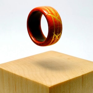 Pink ivory and gold wooden ring