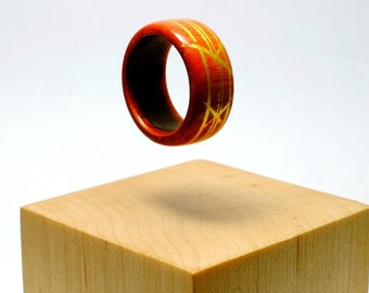 Pink ivory and gold wooden ring