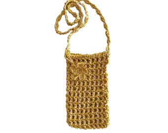 May include: A small yellow crocheted crossbody bag with a flower design. The bag has a long strap and is made of a fine, delicate yarn.