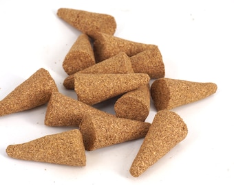 May include: A pile of brown incense cones, made from natural materials, for burning and creating a fragrant atmosphere.