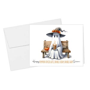 May include: A watercolor illustration of a ghost wearing a witch hat, sitting on a wooden bench, and holding a pumpkin spice latte. A small pumpkin sits beside the bench. The card reads "Happy Pumpkin Spiced Latte, Double Cream, Double Whip Season."