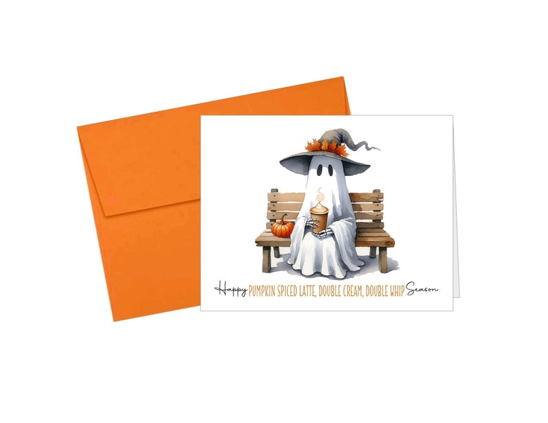 May include: A watercolor illustration of a ghost wearing a witch hat, sitting on a wooden bench, and holding a pumpkin spice latte. A small pumpkin sits beside the ghost. The card reads "Happy Pumpkin Spiced Latte, Double Cream, Double Whip Season."