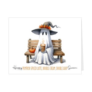 May include: Watercolor illustration of a ghost wearing a witch hat and holding a pumpkin spice latte, sitting on a wooden bench with a small pumpkin. The text reads: Happy Pumpkin Spiced Latte, Double Cream, Double Whip Season.