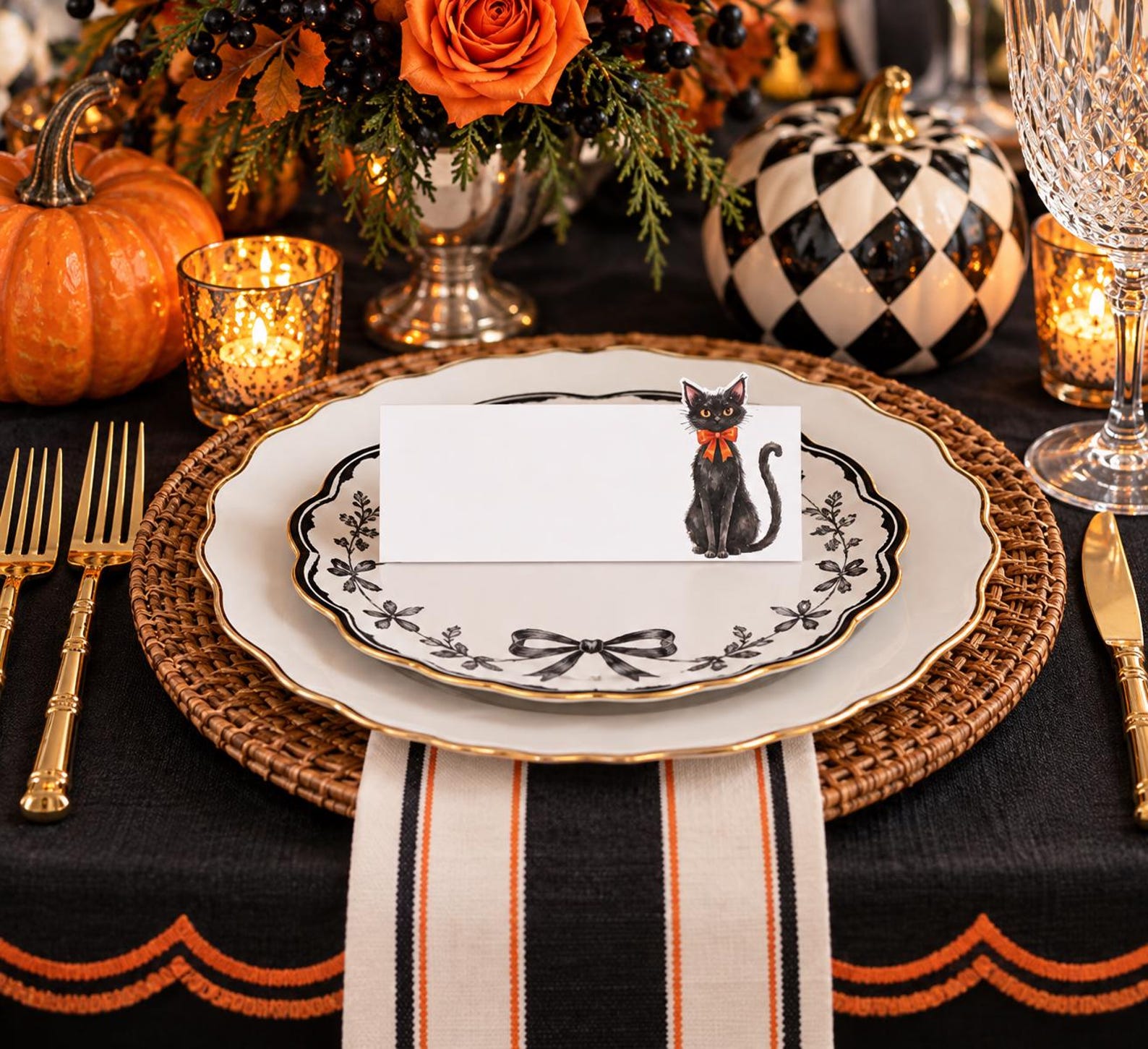 A Black Cat in a Decorative Frame Cat-themed Halloween place card on an ornate white plate with a striped runner.
