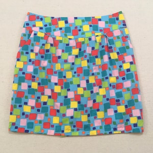 Handmade, mini-skirt, in light blue with colorful square print