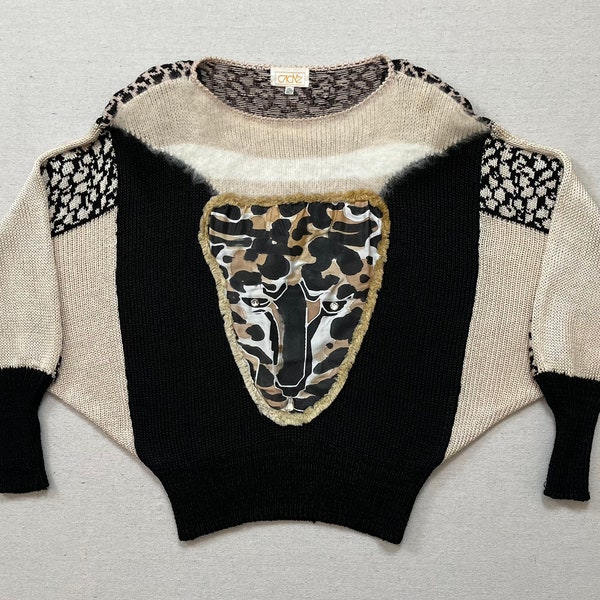 1980's, Dolman Sleeve sweater, in black and cream, with jeweled tiger face and angora trim by Cache