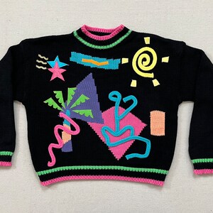 1980's, sweater in black, with colorful, abstract palm tree and designs