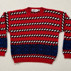 1980&#39;s, sweater in red with black, white and blue, Celtic design