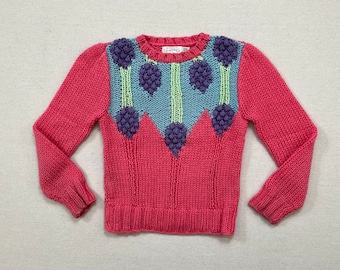 1980's, sweater in pink raspberry with sky blue, pale green and lavender design