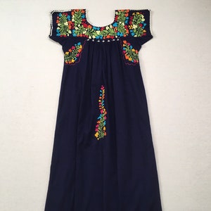 Short sleeve peasant dress, in navy with colorful embroidered flowers