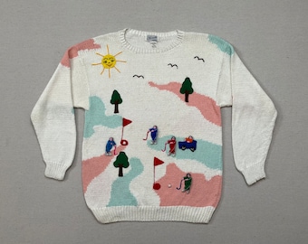 1990's, cotton, golf sweater in white with peach and aqua and colorful, 3D golfing ladies