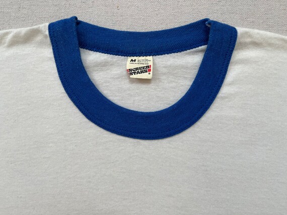 1984 does 1965, ringer tee in white with blue and bla… - Gem