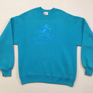1980&#39;s, &quot;Whitecap Mountains&quot; ski sweatshirt, in turquoise