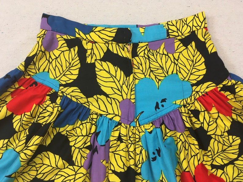 1990's, puffy shoulder, cropped jacket and dropped yoke, mini-skirt set, in colorful, African, floral print image 9