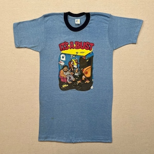 1974, &quot;Its a Bust&quot; ringer tee in blue with navy