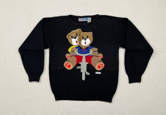 1980's, bike riding, plush face bear sweater in b… - image 1