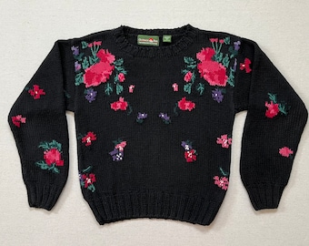 1990's, ramie/cotton blend, sweater in black with flowers in pinks, greens, purple and white by Outback Red