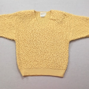 1980&#39;s, short sleeve, V-neck, nubby sweater, in buttercup yellow