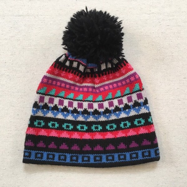 1980's, wool, pompom ski hat, in black, with colorful designs, by Meister