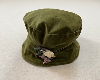 1990's, velvet bucket hat in olive with ornate pin by Tweeds