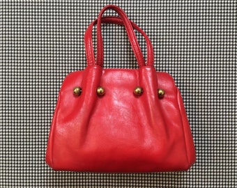 1960's, vinyl, old lady handbag, in bright red, with brass balls