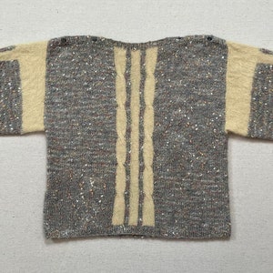 1980&#39;s, short sleeve, boxy cut, button shoulder sweater in nubby, gray, white, yellow and terracotta with creamy yellow, cableknit trim