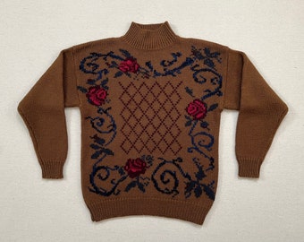 1990's, wool, mockneck sweater in milk chocolate with needlepoint style design in black, blue, raspberry and dark brown