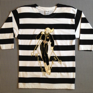 1980&#39;s, black and white striped, oversized, 3/4 sleeve t-shirt, with gold embroidered skiier