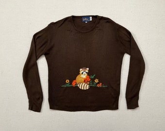 1970's, sweater in dark brown with emboridered racoon, fall leaves, flowers and mushrooms