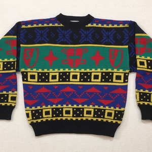 1990&#39;s, wool blend, sweater in black with red, green, yellow and blue, shield design
