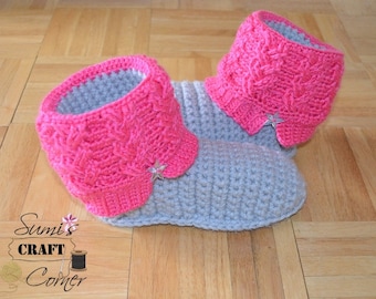 May include: A pair of gray and pink crocheted slippers with a star embellishment on each slipper.