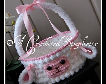 May include: White crocheted Easter basket shaped like a lamb with pink accents and a pink ribbon handle. The basket has a fluffy white texture and a pink face with black eyes.