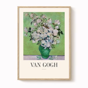 May include: A framed print of Van Gogh's "Roses" features a vibrant bouquet of white roses in a green vase against a green backdrop. The artwork is presented in a light-colored wooden frame, with the artist's name and title displayed at the bottom.