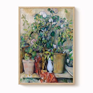 May include: A framed painting depicting potted plants with white and pink flowers, vibrant green leaves, and a red patterned cloth. A white jug and bottles are also present. The artwork features a warm colour palette.