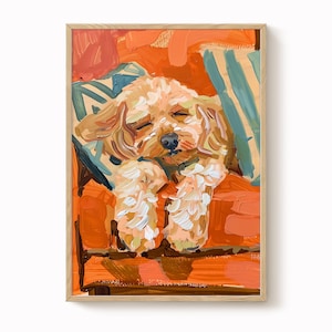 May include: A framed painting depicting a sleeping dog. The dog is light brown with white paws, resting on an orange surface with a blue and green striped cushion. The artwork uses a warm colour palette.