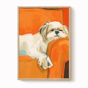 May include: A framed art print of a sleeping Shih Tzu dog resting on an orange chair. The dog has white and brown fur. The artwork is a painting with visible brushstrokes and a wooden frame.