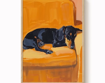 May include: A framed art print of a black and tan dachshund dog resting on an orange sofa. The dog is painted in a relaxed pose, with its head resting on the sofa's arm. The artwork has a warm, inviting feel.